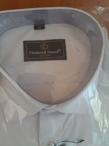 Продаю новую белую рубашку с длинным рукавом размер 42 на рост180см