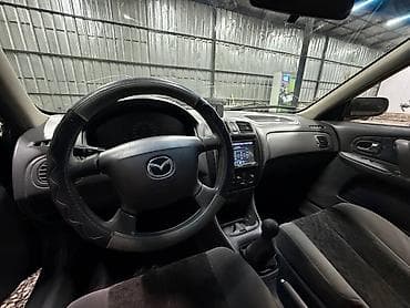 е34 люк: Mazda 323: 2000 г., 1.3 л, Механика, Бензин, Седан — 10
