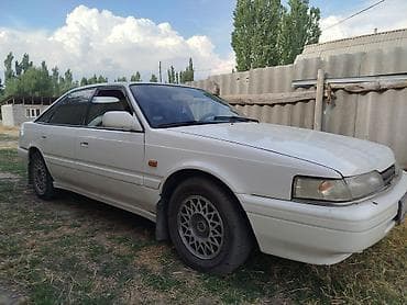 Унаа: Mazda Capella: 1990 г., 2 л, Кол менен иштөөчү, Бензин, Седан — 2