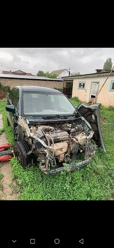 Унаа тетиктери: Suzuki Liana — разбор на запчасти Автомобиль на фотографиях — 4
