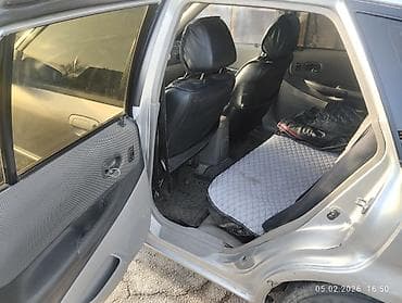 forester 2003: Mazda 323: 2003 г., 1.6 л, Механика, Бензин, Хэтчбэк — 9