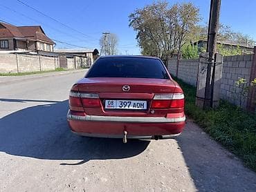 ун басандаткыч: Mazda 626: 1998 г., 1.8 л, Кол менен иштөөчү, Бензин, Седан — 4