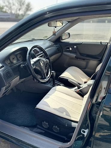 t max: Mazda 323: 2003 г., 1.6 л, Автомат, Бензин, Хэтчбэк — 7