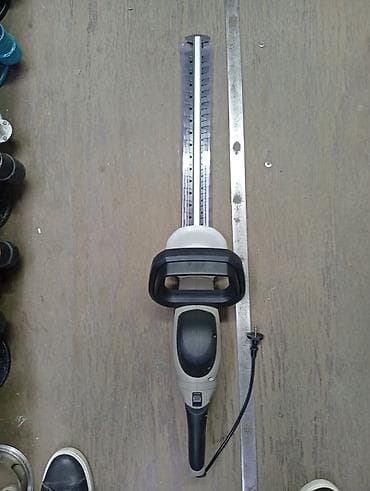 Электрический кусторез/триммер для живой изгороди. - Питание: от сети