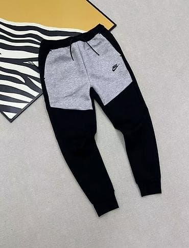 Женская обувь: Мужские спортивные штаны Nike - Крой: джоггеры с зауженными штанинами — 2