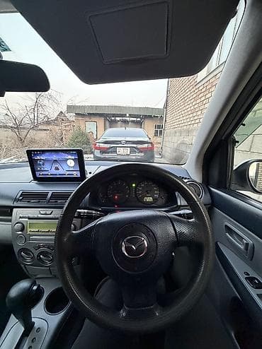 аскар авто: Mazda Demio: 2004 г., 1.3 л, Автомат, Бензин, Седан — 5