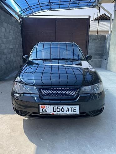 Другие автомобили: Седан черного цвета, государственные номера KG 056 ATE (Киргизстан) — 1