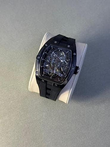 Часы в корпусе бочкообразной формы с открытым скелетонизированным — 5