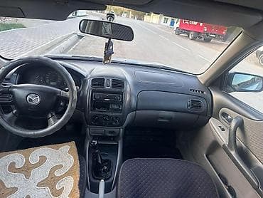 Транспорт: Mazda 323: 2001 г., 1.6 л, Механика, Бензин, Универсал — 6