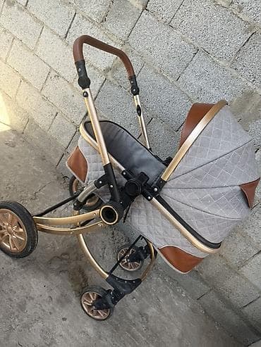 Детская коляска Особенности и комплектация: - Легкая алюминиевая рама