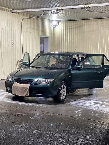 Транспорт: Mazda 323: 2002 г., 1.6 л, Механика, Бензин, Хэтчбэк — 4