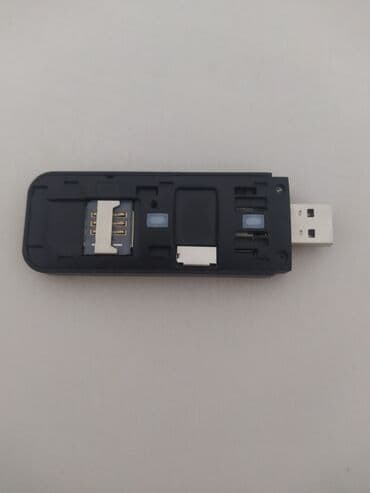 ремонт флешки: Портативный USB-модем черного цвета с матовой поверхностью, оснащенный — 3