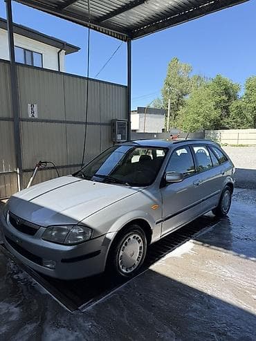 mercedesbenz 211: Mazda 323: 2000 г., Механика, Бензин, Универсал — 2