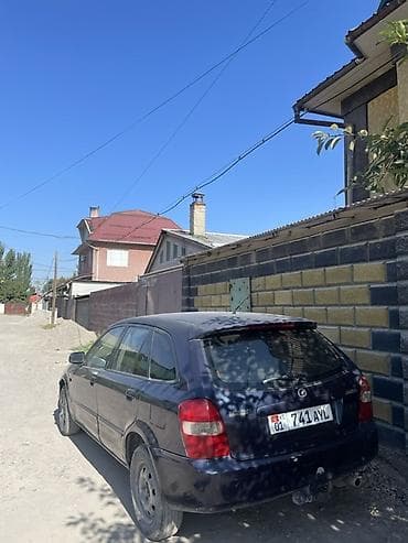 mazda 2: Mazda 323: 2001 г., 1.6 л, Механика, Бензин, Хэтчбэк — 3