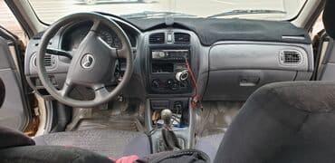 купить трактор бу мтз 82: Mazda 323: 2000 г., Механика, Бензин, Седан — 7