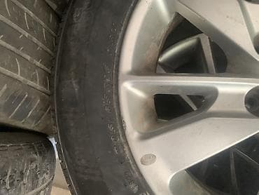 Литой диск KIA с шиной 205/65 R16 - Оригинальный литой диск KIA — 1
