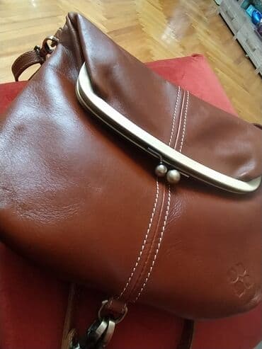 Новая кожаная сумка фирменная с Америки,на поцелуйчиках можно носить