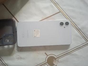 Смартфон с двойной основной камерой и вспышкой. Корпус светлый (на at lalafo.kg Смартфон с двойной основной камерой и вспышкой. Корпус светлый (на