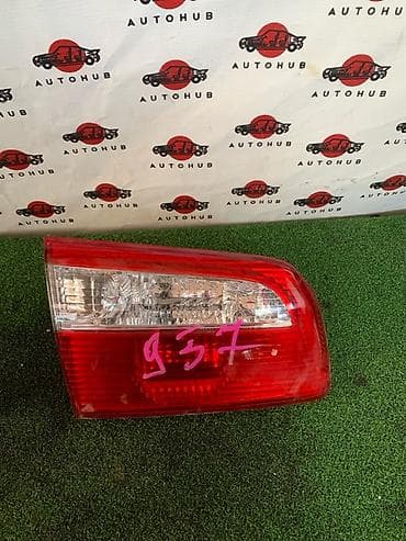 second caddy hdd: Фонарь крышки багажника Mazda Capella GW8W 1.8 2002 лев. (б/у) — 1