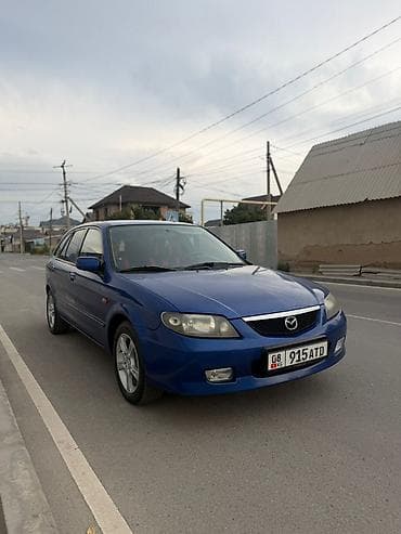 Унаа: Mazda 323: 2003 г., 1.6 л, Кол менен иштөөчү, Бензин, Хетчбек — 7
