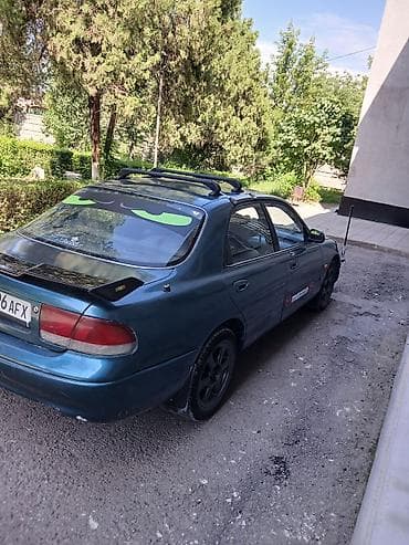 demio бампер: Mazda Cronos: 1993 г., 2 л, Автомат, Бензин, Седан — 10