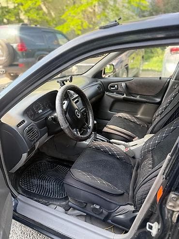 e klass: Mazda 323: 2002 г., 1.5 л, Автомат, Бензин, Седан — 4