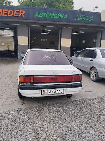 zero x neo: Mazda 323: 1990 г., Механика, Бензин, Седан — 4