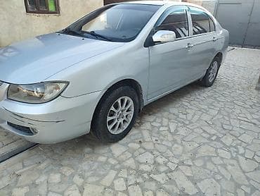 глушитель для нексия: Седан серебристого цвета с тонированными задними стеклами — 9