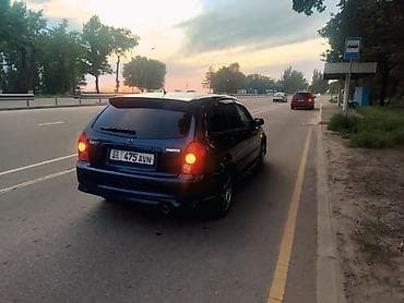 Mazda Familia: 2002 г., Хэтчбэк — 5