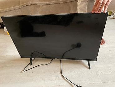 40: Телевизор TCL, диагональ около 32–40". Особенности и подключение: - — 1