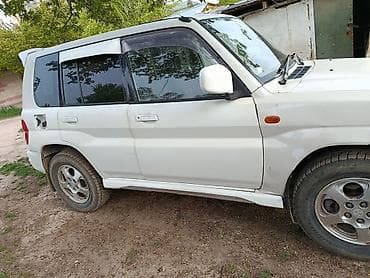 daihatsu core: Mitsubishi Pajero iO: 1999 г., 2 л, Механика, Бензин, Внедорожник — 3