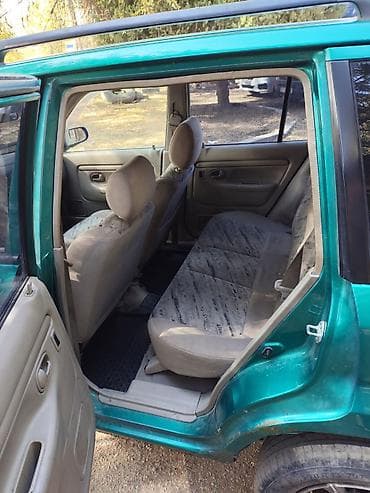 Транспорт: Mazda Demio: 1999 г., 1.3 л, Механика, Бензин, Хэтчбэк — 6