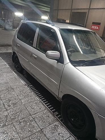 Mazda Demio: 1997 г., 1.5 л, Механика, Газ, Универсал — 5
