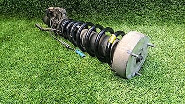 е70 e70: Передний амортизатор BMW 2009 г., Б/у, Оригинал — 1