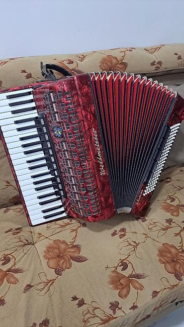 музыкальный инструмент: Аккордеон Weltmeister (клавишный), красный перламутровый корпус — 1
