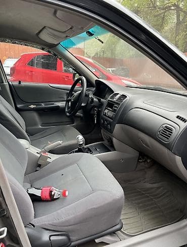 sky way: Mazda 323: 2002 г., 1.3 л, Механика, Бензин, Универсал — 4