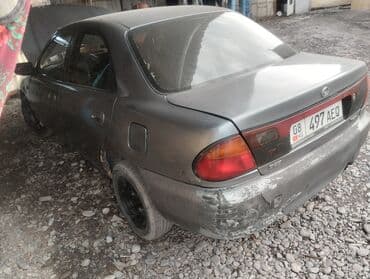 дайво мубира: Mazda 323: 1995 г., 1.5 л, Механика, Бензин, Седан — 3