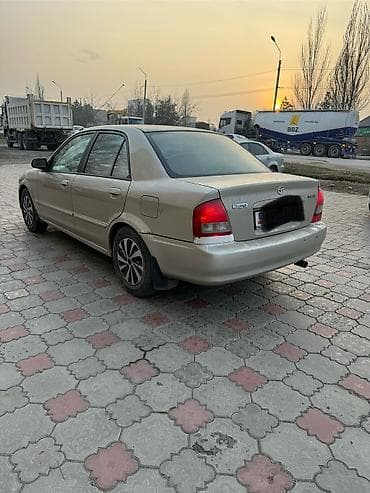срочные автомобили: Mazda Demio: 1999 г., 1.6 л, Автомат, Бензин, Седан — 7