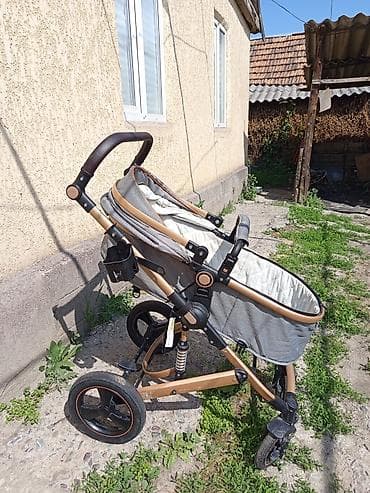 эмили коляска: Универсальная детская коляска с золотистой рамой и серым сиденьем — 3