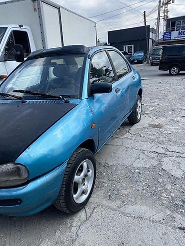 Унаа сатуу: Mazda 121: 1991 г., Кол менен иштөөчү, Бензин, Седан — 2