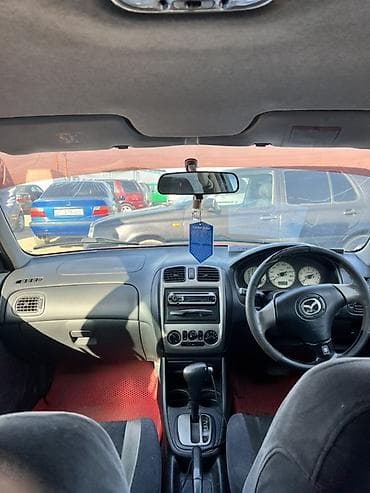 машина li: Mazda Familia: 1990 г., Автомат, Седан — 4