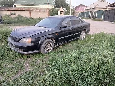 Седан черного цвета, 4 двери. Кузов даево Магнус год 2000 об 2 автомат at lalafo.kg Седан черного цвета, 4 двери. Кузов даево Магнус год 2000 об 2 автомат