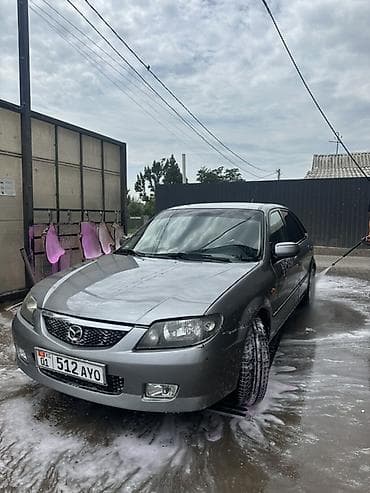 мини машины для взрослых: Mazda Familia: 2002 г., Механика, Бензин, Седан — 1