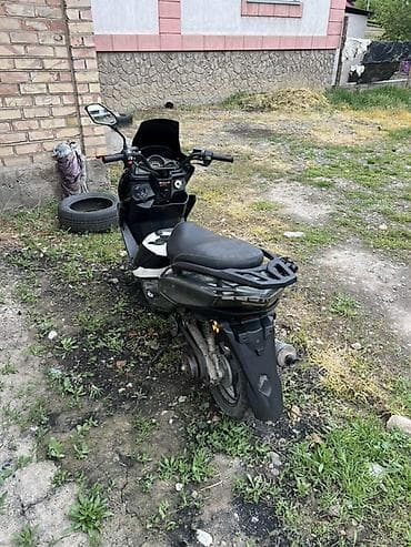 скутор новый: Скутер/максискутер серо‑черного цвета Описание: - Городской скутер с — 1