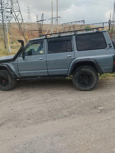 кел кел: Nissan : 1991 г., 3.2 л, Кол менен иштөөчү, Дизель, Жол тандабас — 3