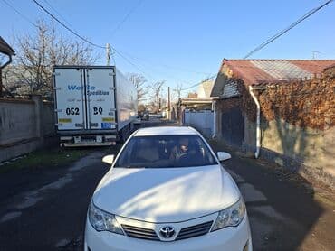 камри салон: Toyota Camry (салон) - Руль: многофункциональный, обтянутый кожей, с — 5