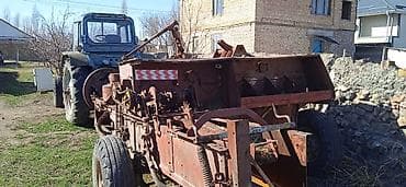 Тракторы LG: Трактор с прицепной сельхозтехникой Описание: - Колёсный трактор — 6