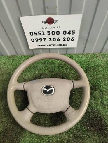 demio: Руль Mazda — 1