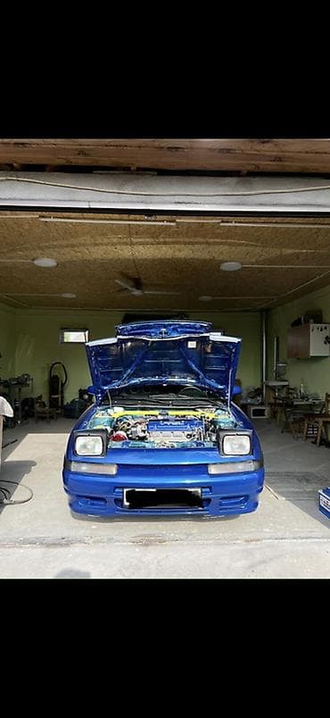 colf 2: Mazda Familia: 1992 г., Бензин, Хэтчбэк — 2