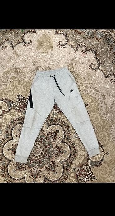 штаны джогеры: Серые мужские спортивные штаны Nike Tech Fleece стильного зауженного — 1